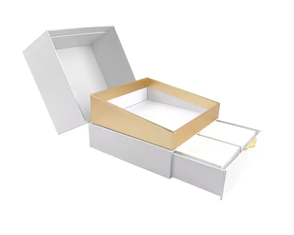 Multi-layer drawer packaging box with gold accents and custom structure design.