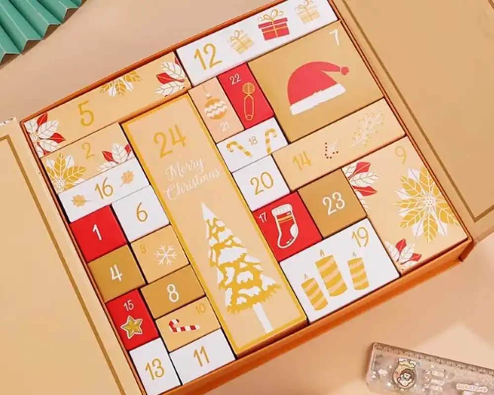 Luxury Christmas advent calendar box with numbered compartments and festive holiday designs.