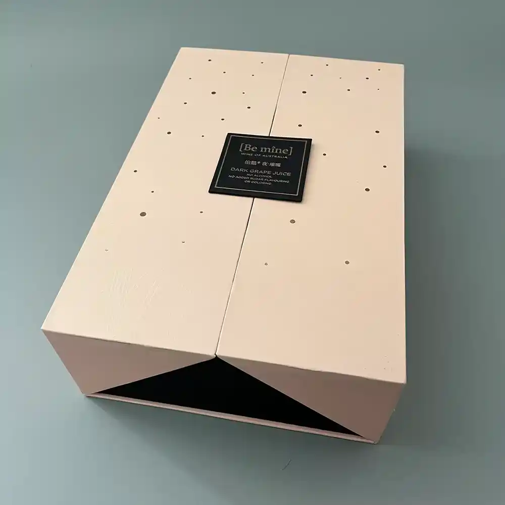 Closed beige double-door magnetic wine gift box with minimalist label.