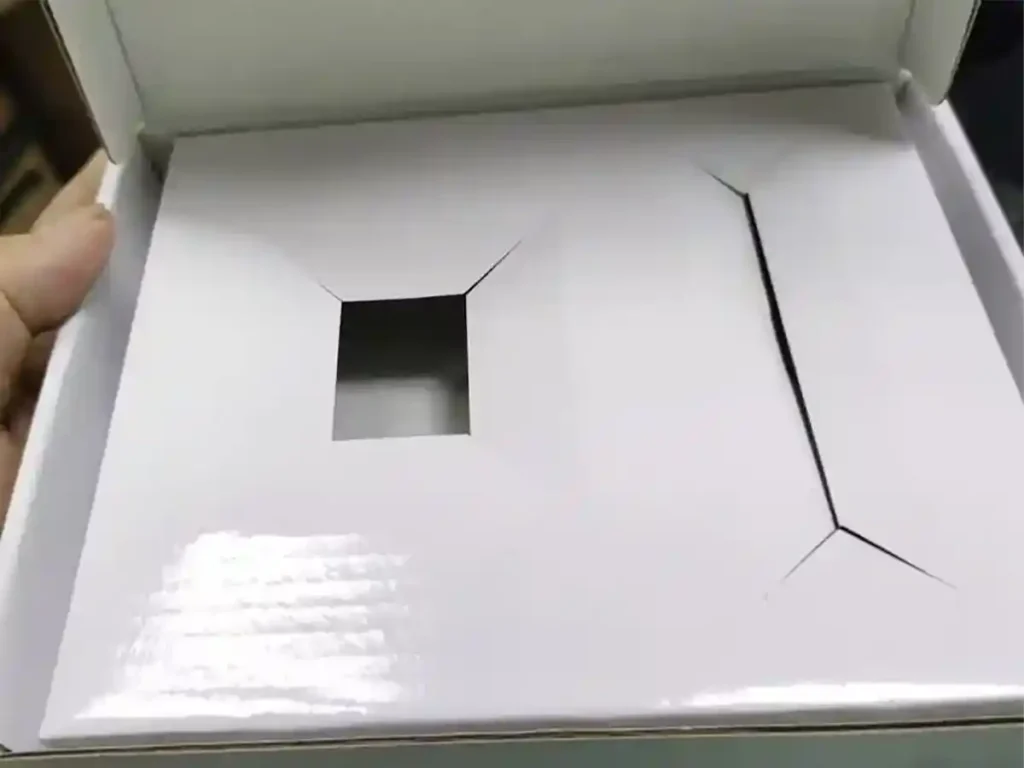 White hybrid packaging box with custom die-cut insert for product display.