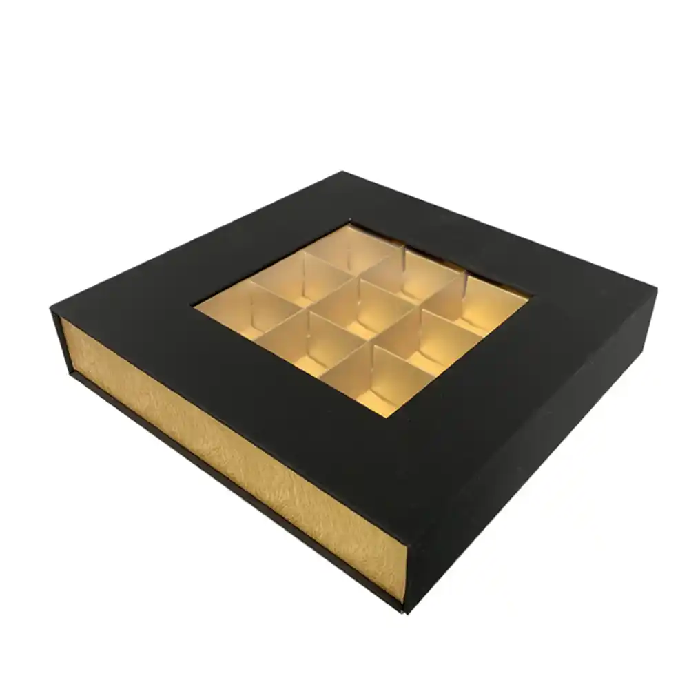 Black and gold magnetic chocolate box with clear window and grid inserts.