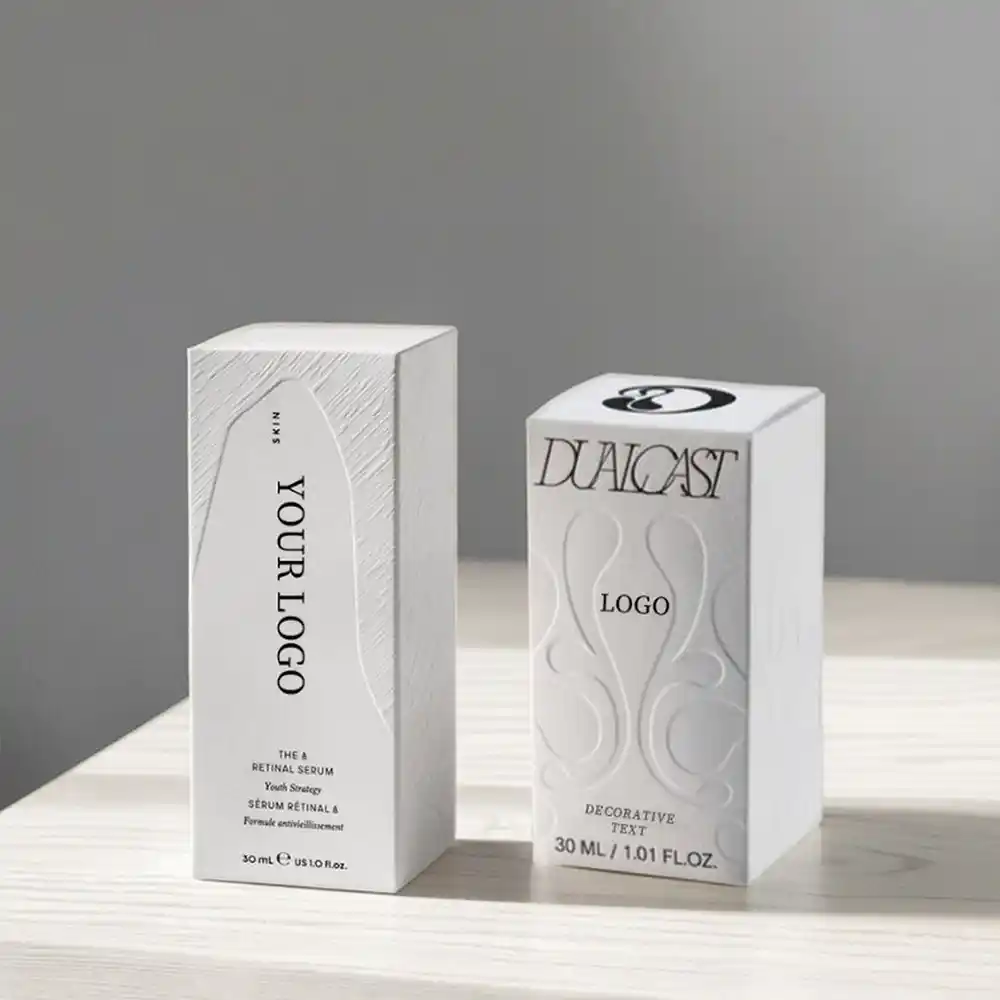 White embossed cardboard packaging boxes for serum and cosmetic bottles