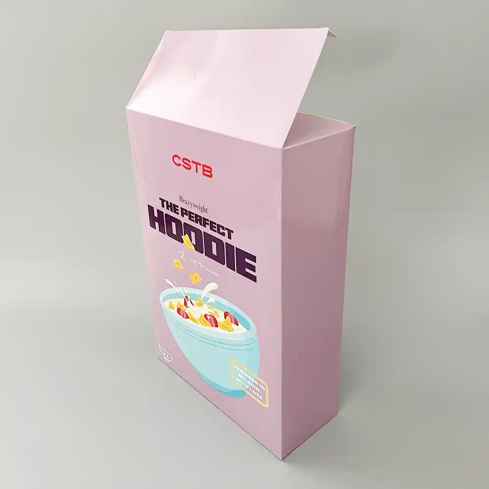 Pink cereal-style clothing box with “The Perfect Hoodie” design