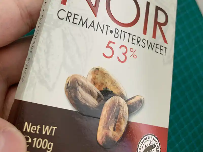 Embossed chocolate packaging with UV coating and cocoa bean design.