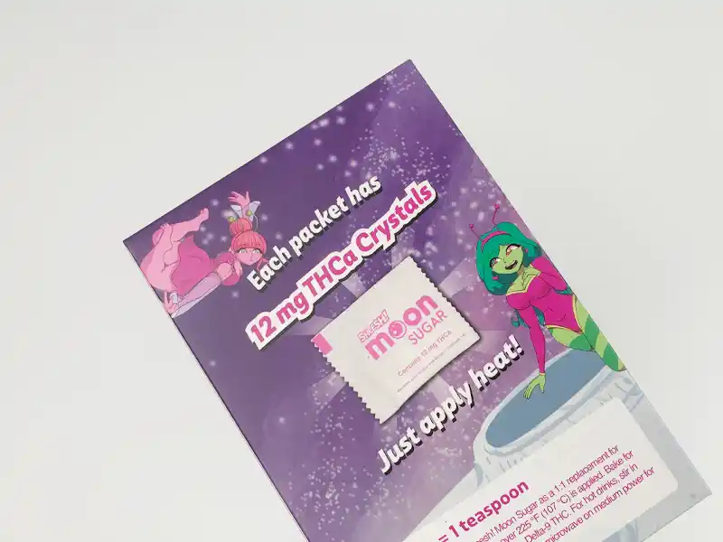 Matte laminated product flyer with colorful cartoon design and THCa crystal packet