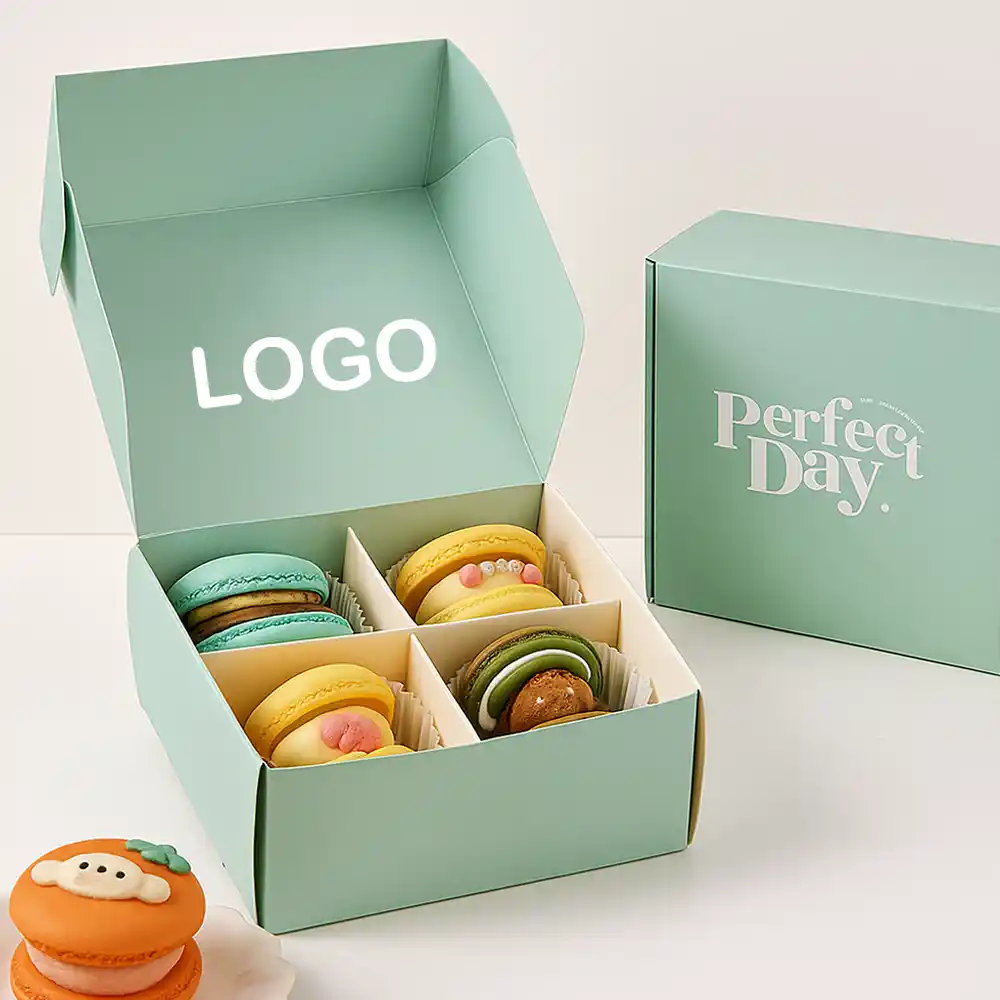 Mint green folding macaron box with dividers and assorted colorful macarons