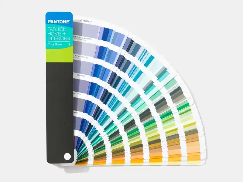 Pantone color fan deck showing blue, green and neutral swatches
