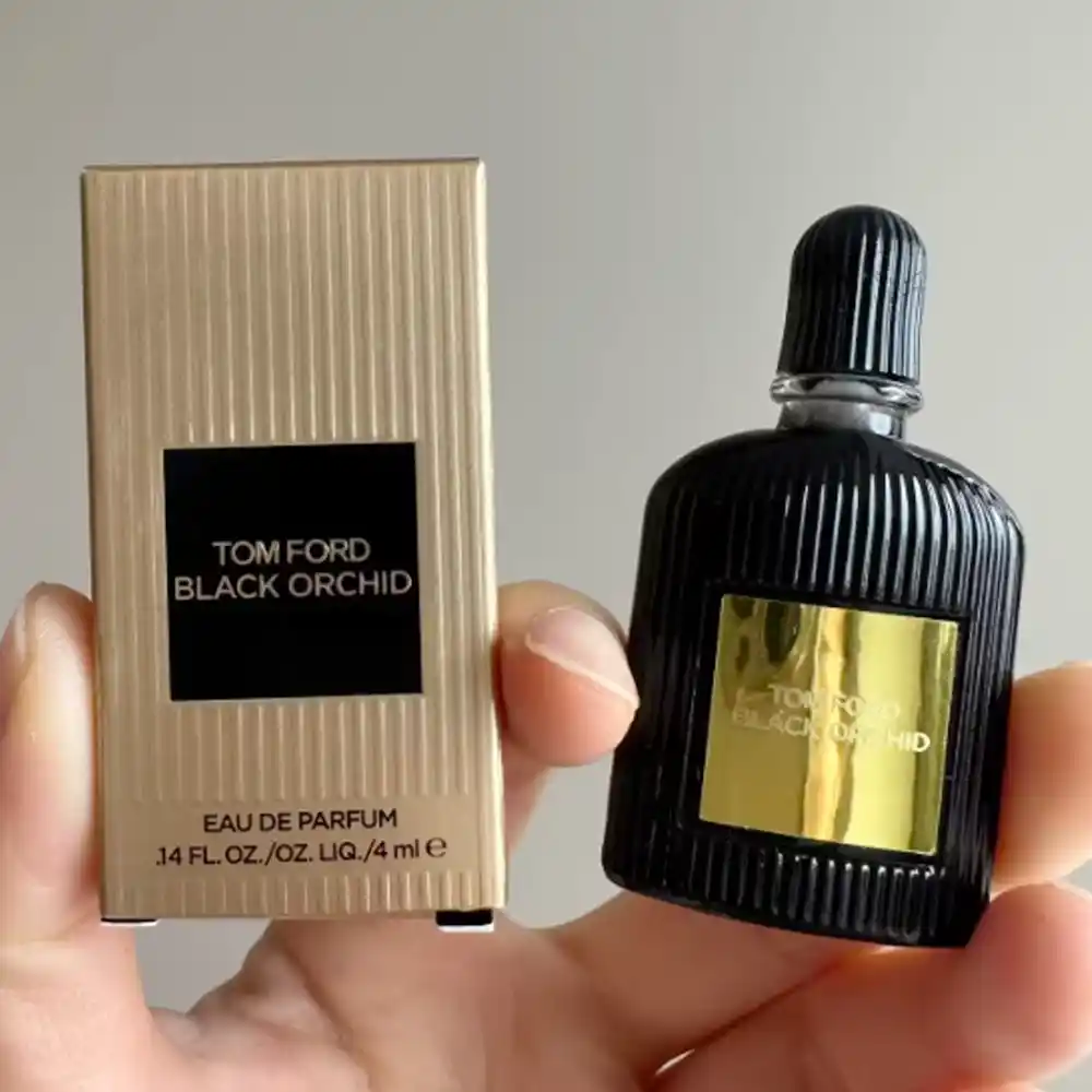 Tom Ford Black Orchid mini perfume with gold ribbed paper box.