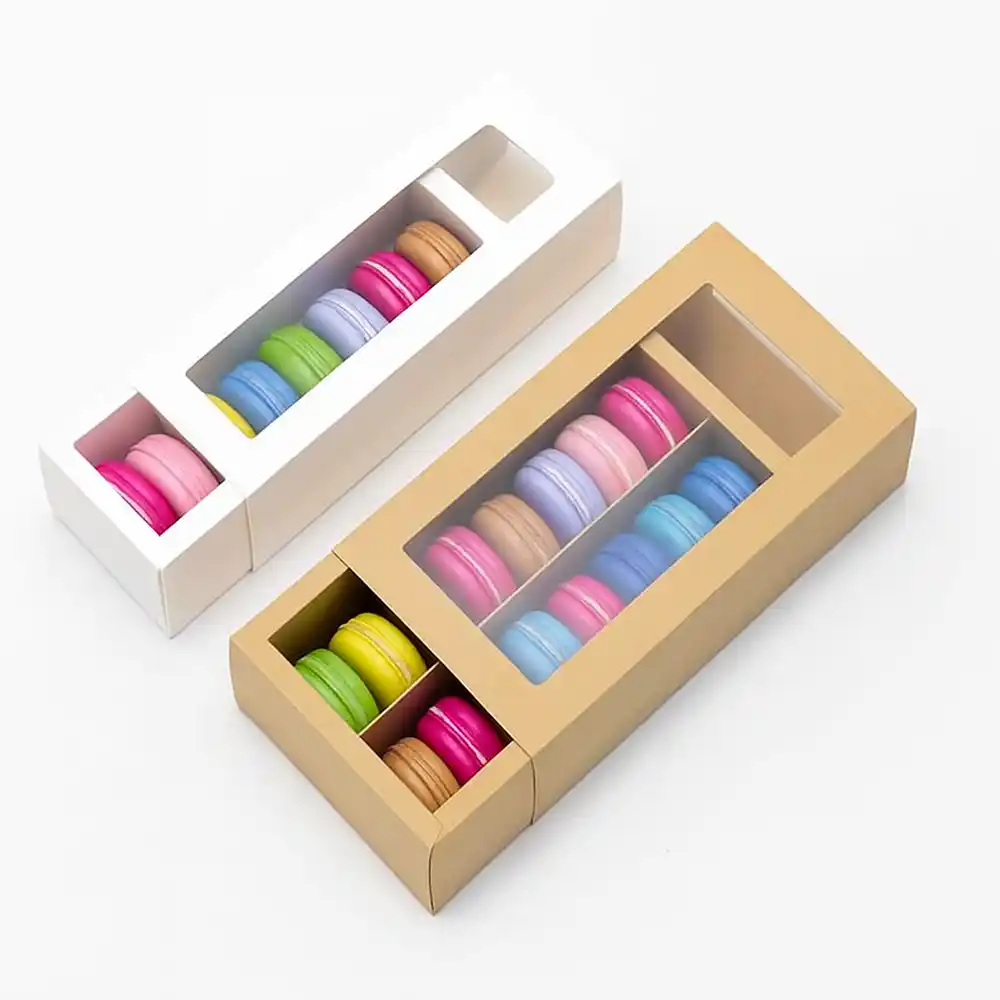 White and kraft macaron boxes with clear window lids displaying colorful macarons