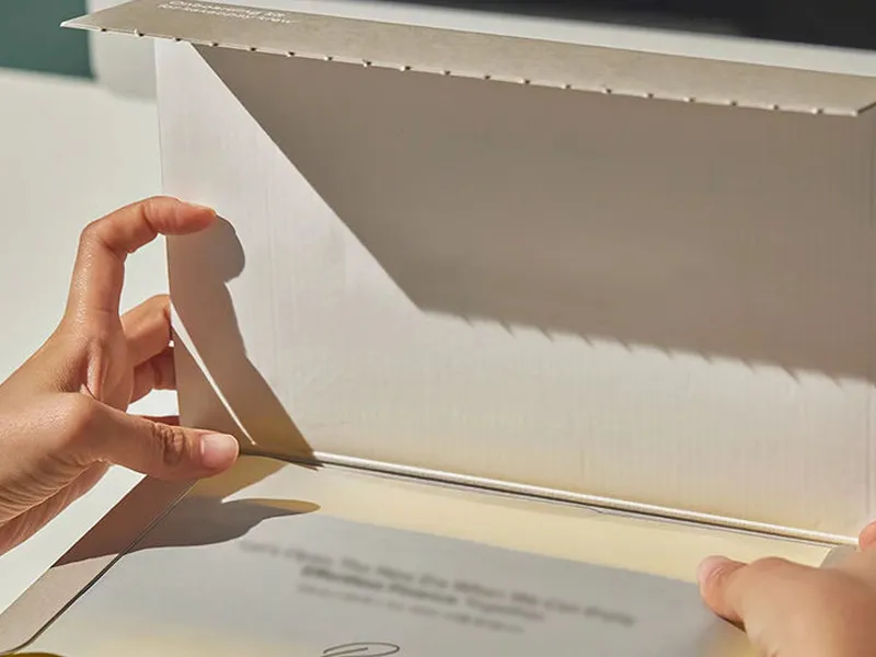 Open kraft mailer box with peel liner and adhesive closure