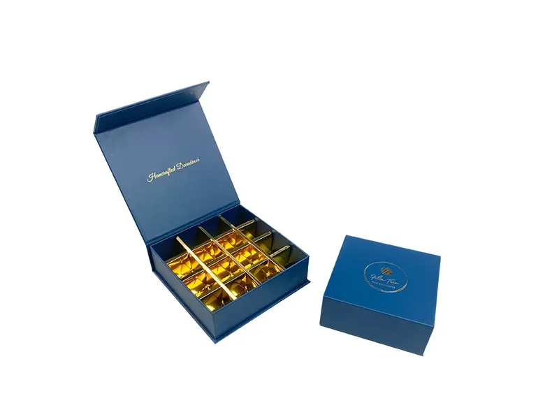 Blue magnetic closure box with hinged lid and gold insert tray for chocolate gift packaging