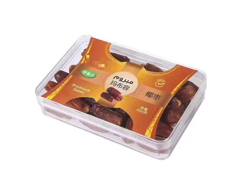 Clear plastic date box packaging with printed paper sleeve for premium dates